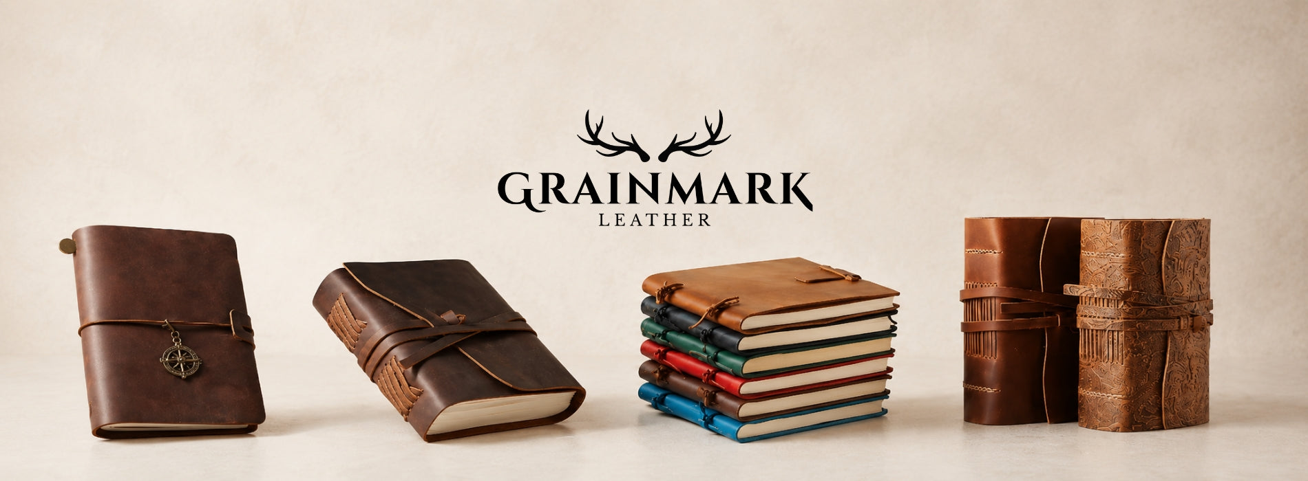 Refillable leather journal collection displayed with Grainmark Leather branding on a warm studio background